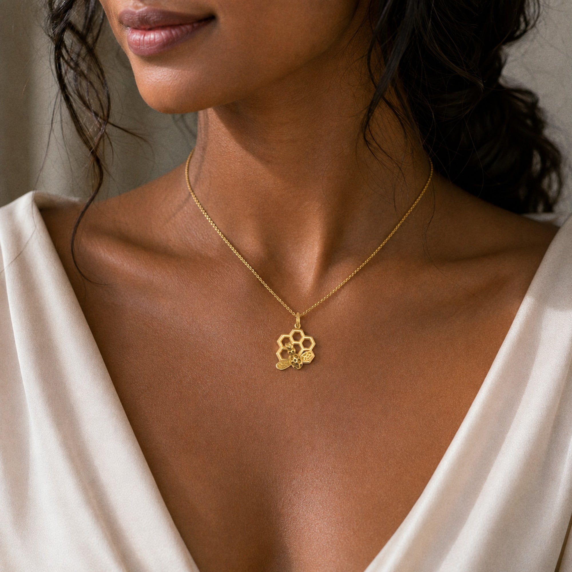 Bee on honeycomb necklace in 18K yellow gold on an 18-inch chain, inspired by the Fairmont Hotel rooftop beehive, handmade in San Francisco
