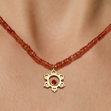 Orange sapphire matte sacral necklace with 18K yellow gold hammered pendant, fire opal center, and 36.5-carat graduated faceted orange sapphire chain, handmade in San Francisco