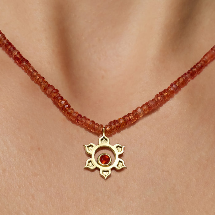 Orange sapphire matte sacral necklace with 18K yellow gold hammered pendant, fire opal center, and 36.5-carat graduated faceted orange sapphire chain, handmade in San Francisco